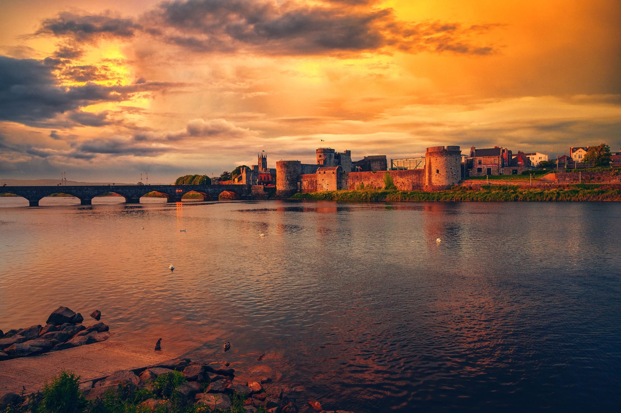 Aerial view of King Johns castle surrounded by water in Limerick during sunset
